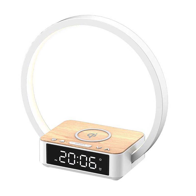 Modern clock with wireless charging pad and LED display on a white background