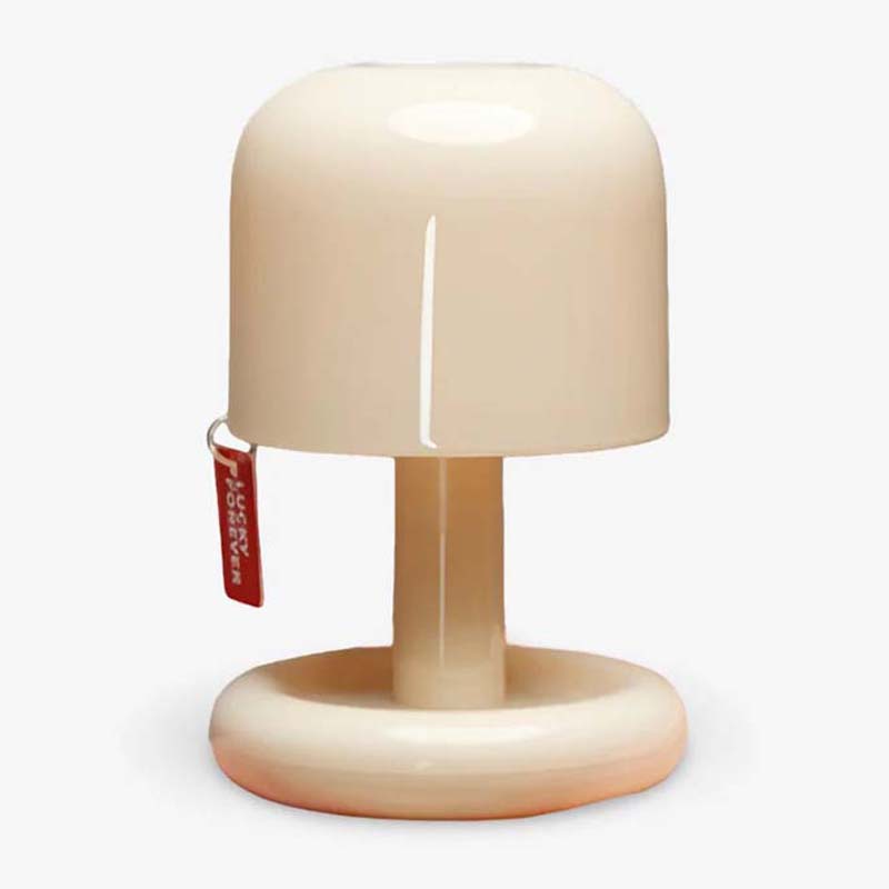 Beige lamp with a red tag on a white background