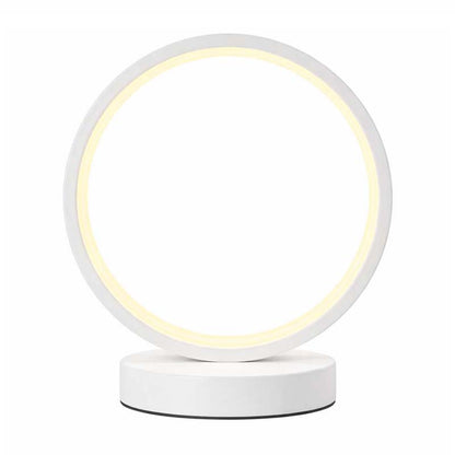 Modern white LED ring table lamp on a white background