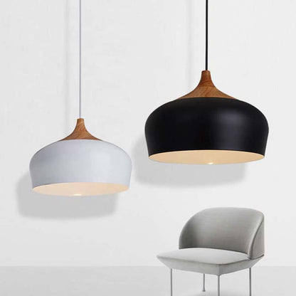 Two pendant lights with wooden tops and different colored bases on a white background.