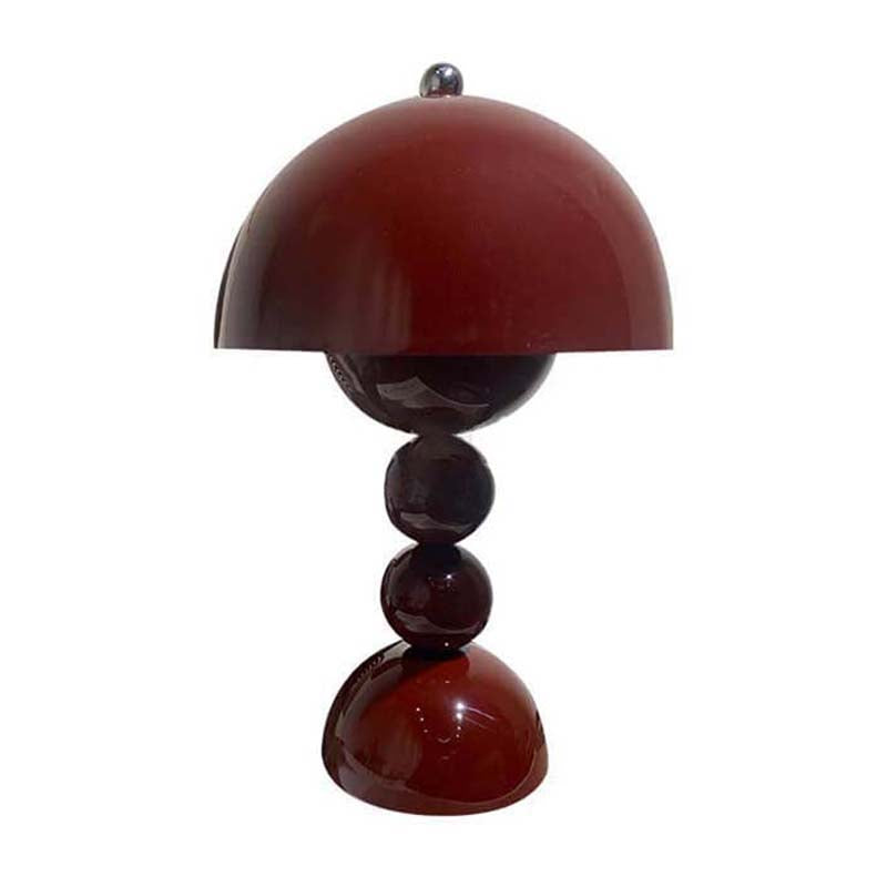 Table lamp with a red-brown shade and cylindrical base on a white background