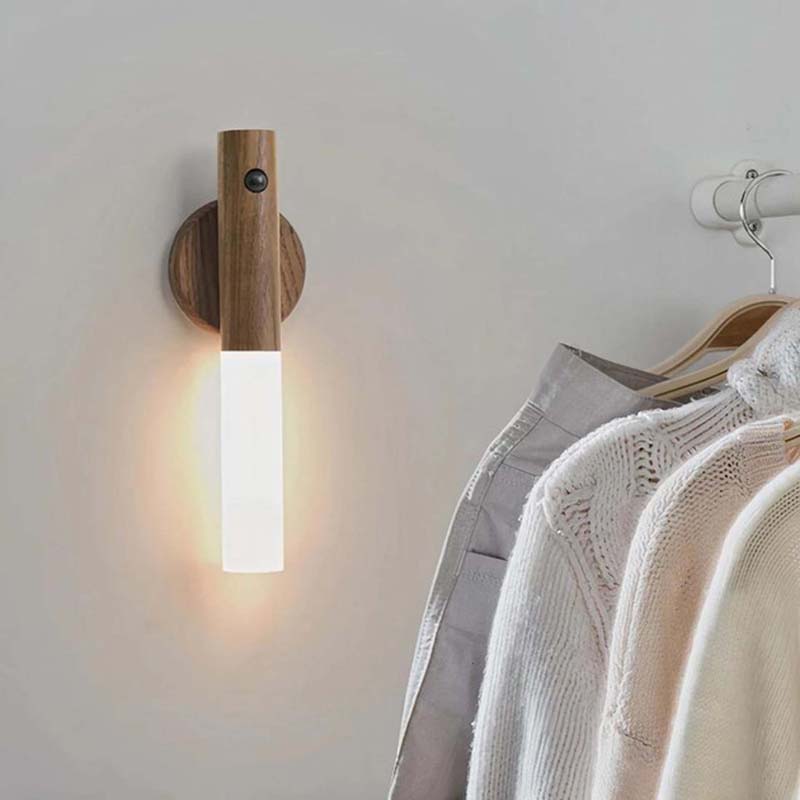 Wireless LED wall light with motion sensor installed in a closet, automatic indoor lighting for wardrobe and storage spaces