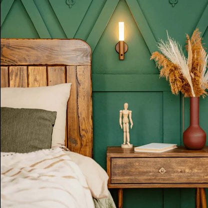 Wireless LED bedside wall lamp with motion sensor mounted near the bed for convenient nighttime bedroom lighting