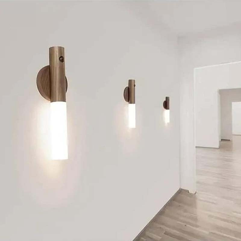 Modern wireless LED wall sconce with built-in motion sensor used as indoor accent lighting in a contemporary home