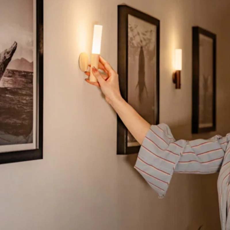 Wireless LED wall light with motion sensor and touch control used as modern accent lighting indoors