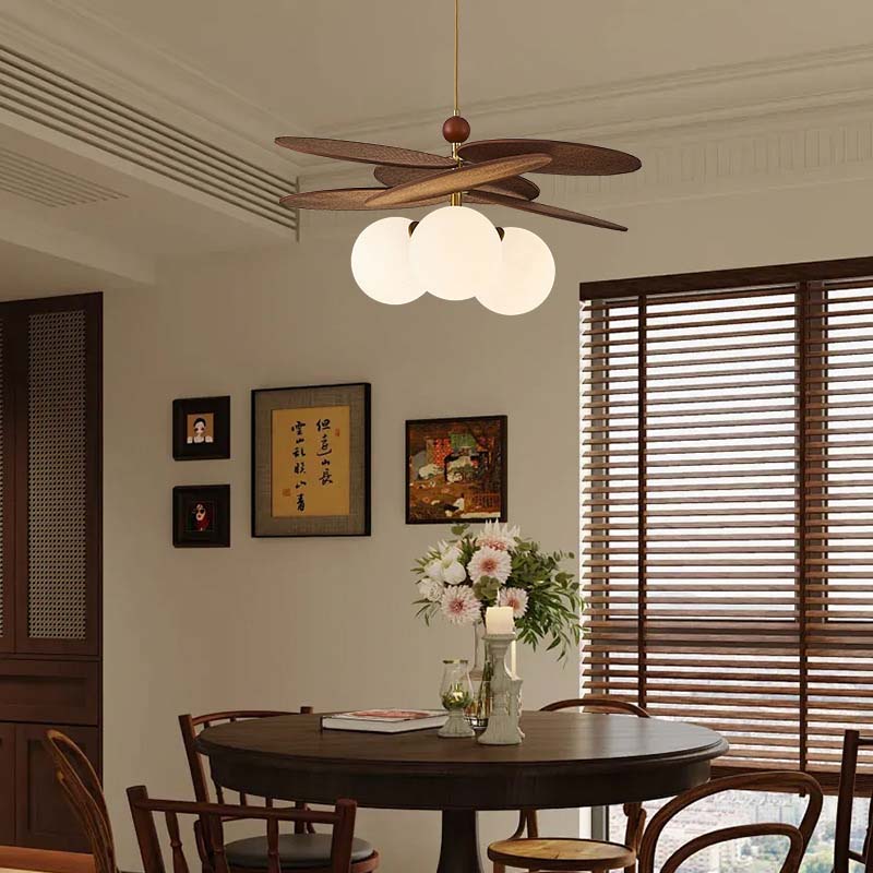 Wooden pendant light above a round dining table