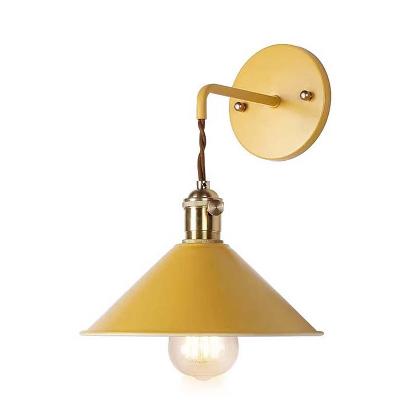 Yellow wall lamp with a white bulb on a white background