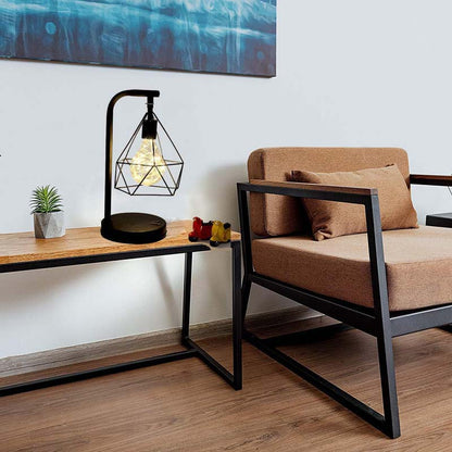 Black Geometric Loft LED Table Lamp in the living room on a table next to a soft chair