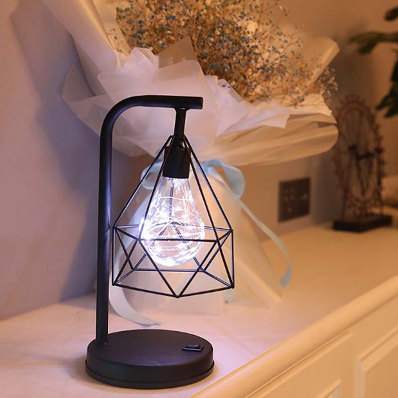 Geometric Loft LED Table Lamp with a bouquet of flowers on the table