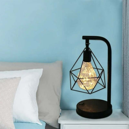 Black Geometric Loft LED Table Lamp on a bedside table