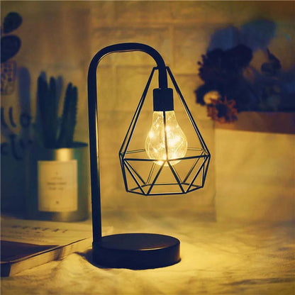 Black Geometric Loft LED Table Lamp on the table in the evening