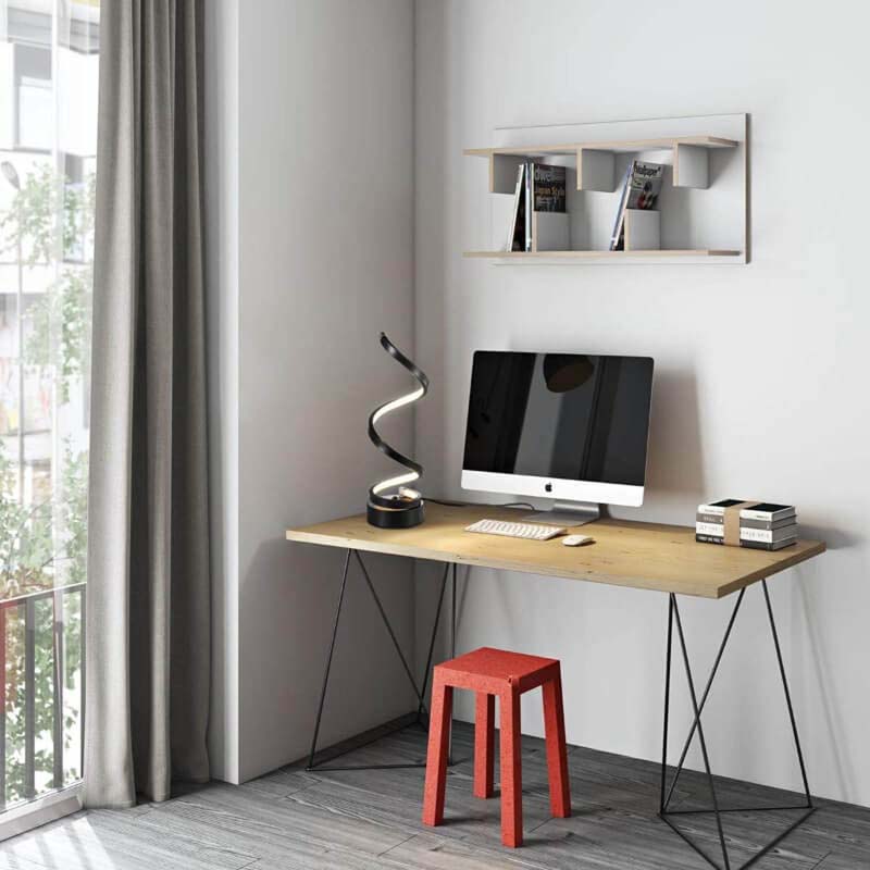 Modern home office with Sculptural Spiral LED Table Lamp on wooden desk, computer monitor and red stool below.