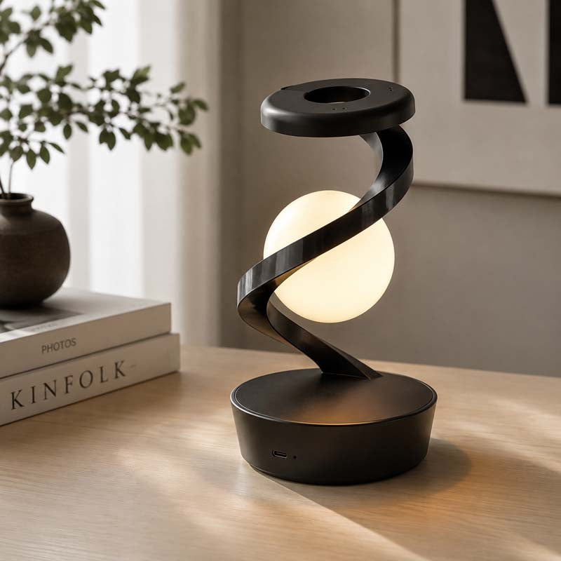 Saturn Helix – LED Desk Lamp with Wireless Charging placed on a light wooden tabletop will fit seamlessly into a stylish interior.