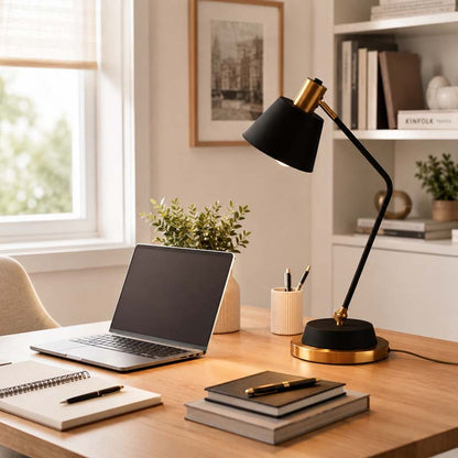 The Modern Adjustable LED Reading Desk Lamp sits on a wooden desk in a bright home office next to a laptop, notepad, and books.
