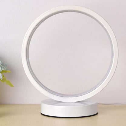 White ring lamp with LED light on a minimal background