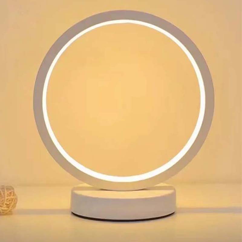 Modern LED ring table lamp, minimalist design with soft warm light, stylish bedside or living room lighting