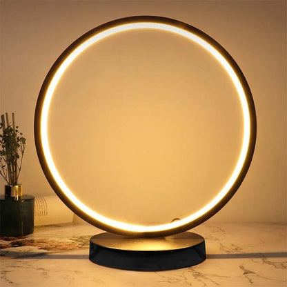 Decorative LED ring table lamp with warm light, modern accent lighting for cozy home decor and ambient atmosphere