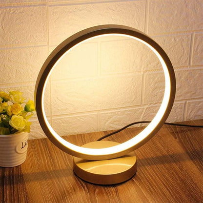 Warm LED ring table lamp 3000K, modern decorative desk light for cozy home interior and ambient lighting