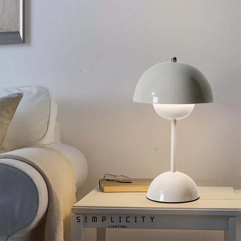 White table lamp on a side table with a neutral background