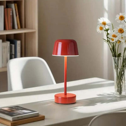 A Rechargeable Cordless Touch LED Table Lamp sits on a white desk in a softly lit home office.