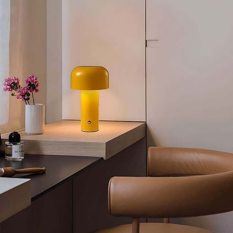 Rechargeable Mushroom LED Table Lamp in a minimalist interior with a brown leather chair and neutral walls.