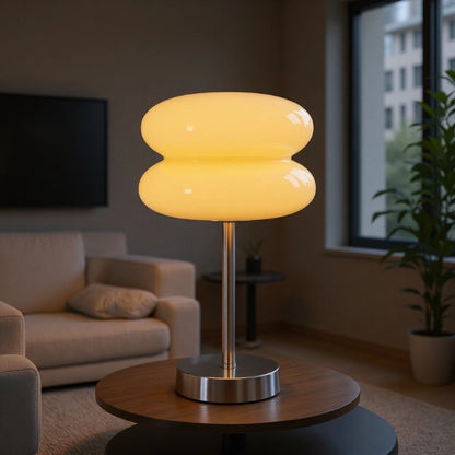 Retro Sandwich Glass Table Lamp placed on a round wooden coffee table in a cozy living room setting.
