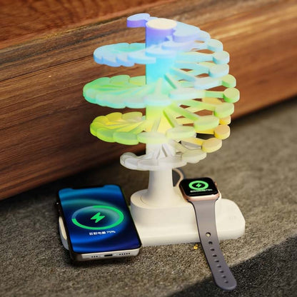 Spiral Tree LED Desk Lamp, shown with rainbow gradient backlighting, with a wood surface visible in the background.