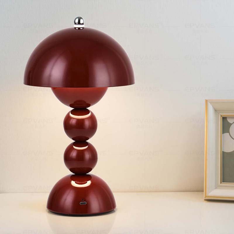 Red table lamp with a unique design on a light background