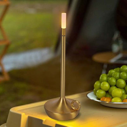 Gold Touch-Sensitive Candle Lamp on a Table with Grapes in the Background