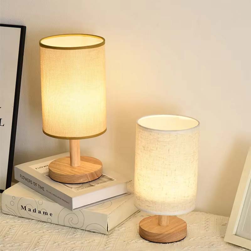 Wood Table Lamp with Natural Fabric Shade on the table with two lampshade options