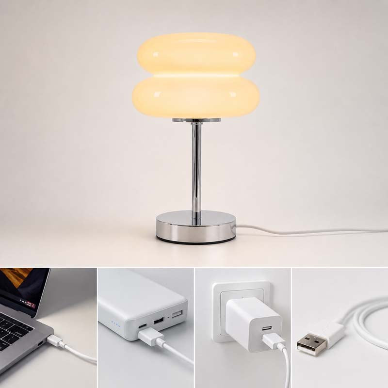 The Retro Sandwich Glass Table Lamp, shown in a studio setting in lighting mode. The four small images below demonstrate the white USB charging cable and the charging port's compatibility with a laptop, power bank, wall outlet, and USB device.