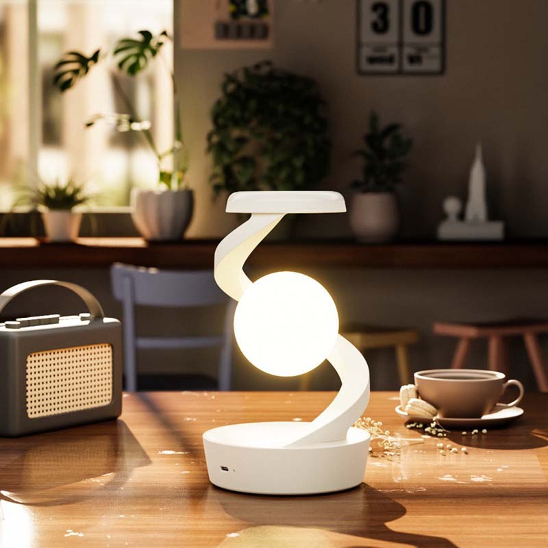 Saturn Helix – LED Desk Lamp with Wireless Charging on a wooden surface in a cozy interior setting.