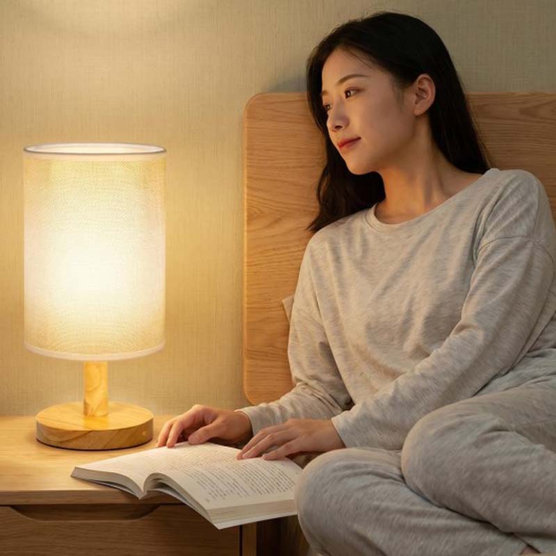Wood Table Lamp with Natural Fabric Shade on the bedside table in the bedroom